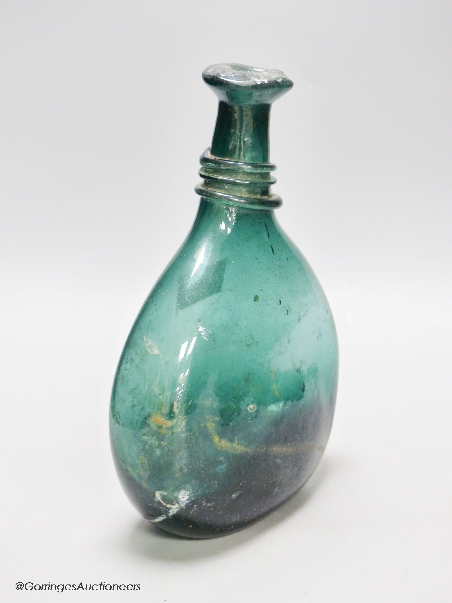 An 18th/19th century Persian green glass flask, Qajar dynasty, height 26cm